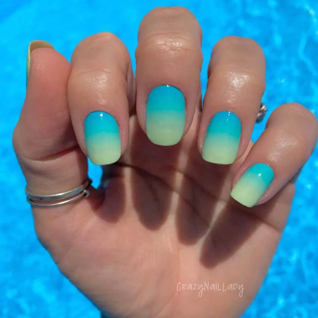 Short square nails with teal to yellow ombre by the pool