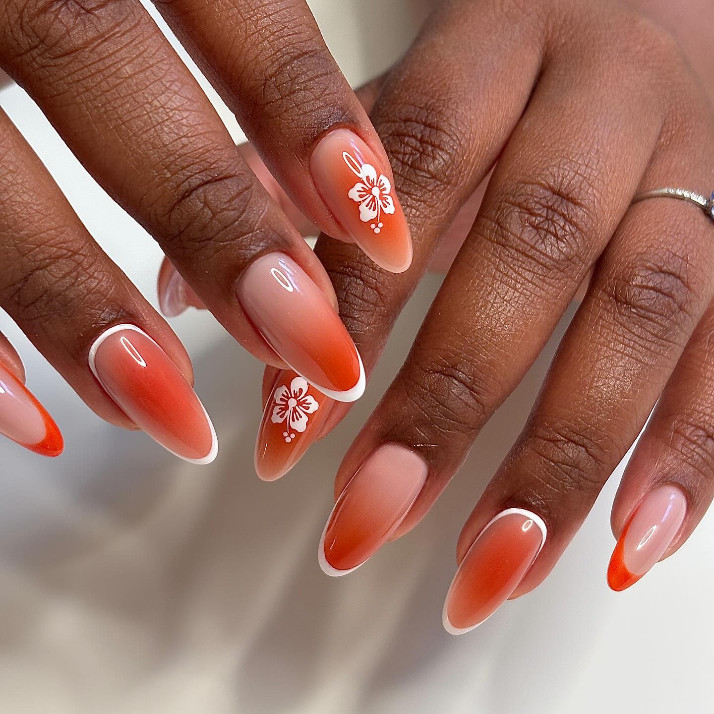 Terracotta orange ombre almonds with white hibiscus French tips