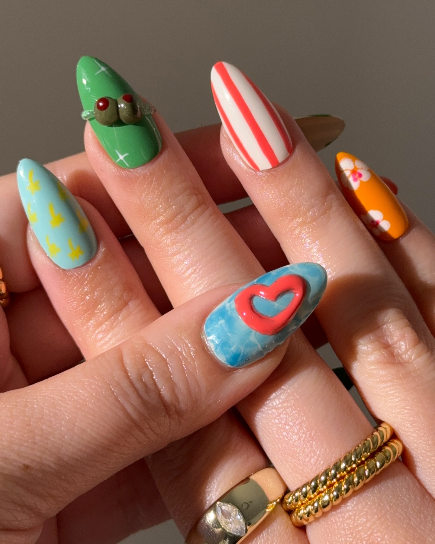 Eclectic tropical almond nails with olive 3D hibiscus and ocean heart