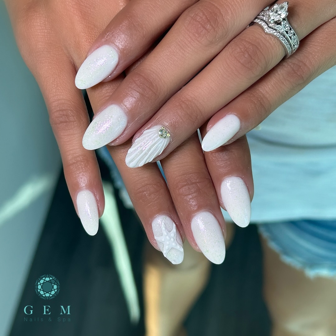 White iridescent almond nails with sculpted clamshell and white starfish accents