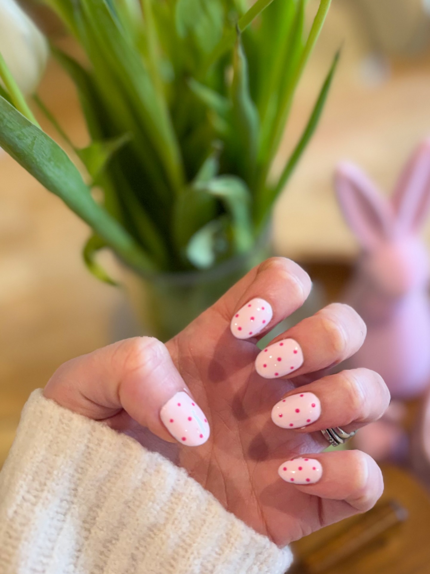 White nails with hot pink polka dots