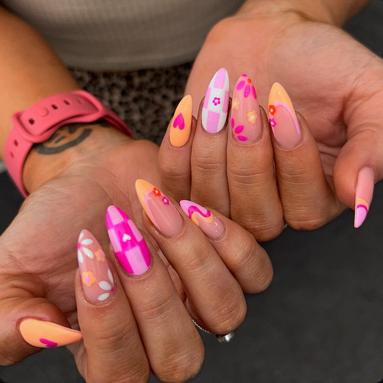 Bold mix of pink, peach and orange with hearts, flowers, and abstract swirls