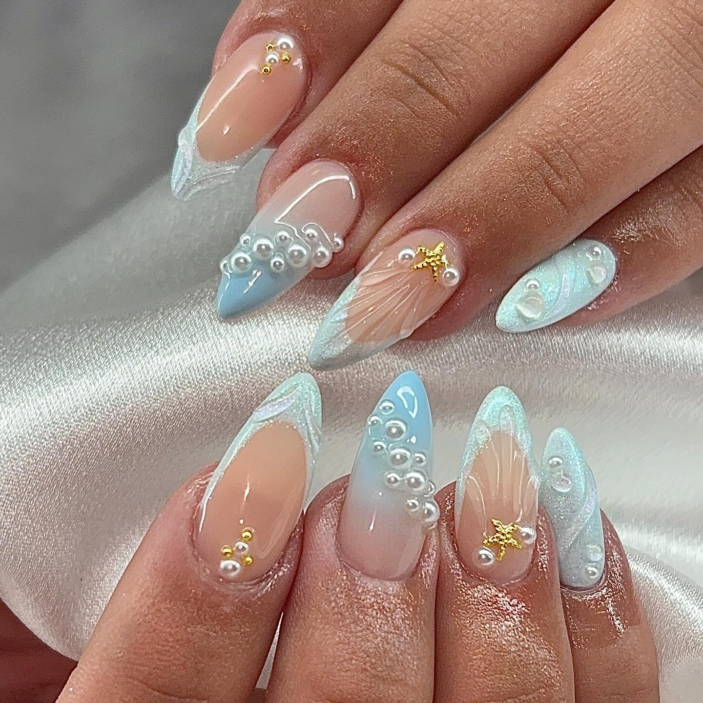 nails featuring a 3D ocean-themed "mermaidcore" design with soft blue gradients