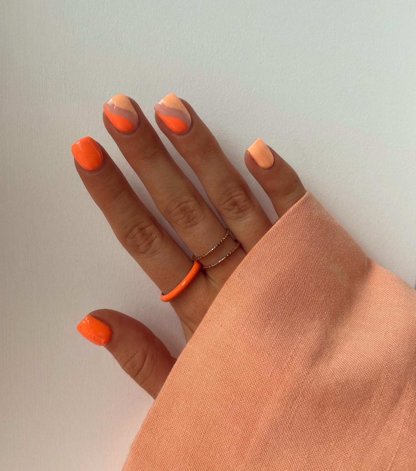 Two-tone abstract swoosh in vivid orange and soft peach