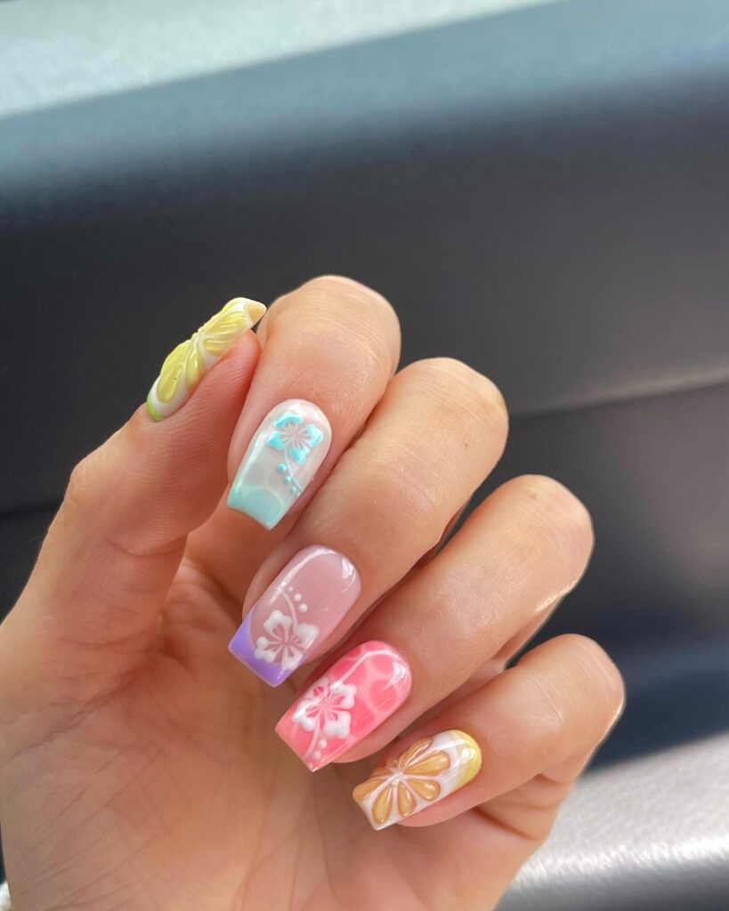 Short square nails with pastel rainbow ombre and 3D butterfly nail art on each finger