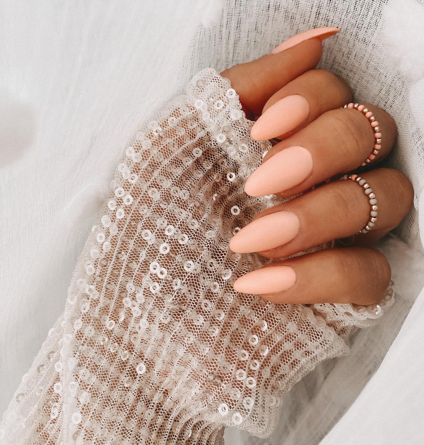almond-shaped matte peach nails