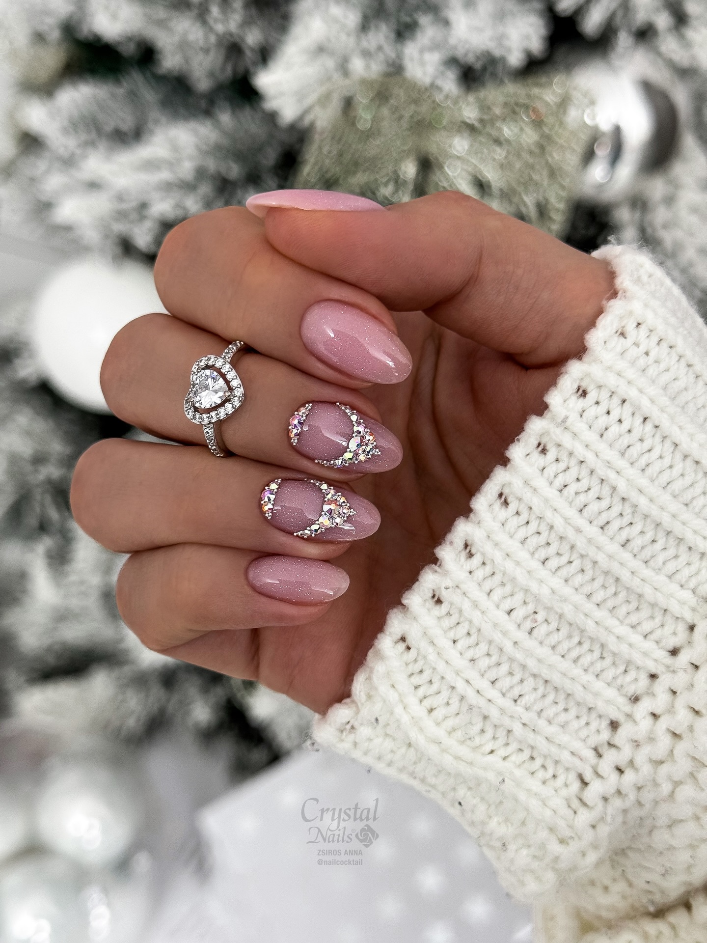 Rosy pink almond nails with delicate silver rhinestone deer antler art and crystal accents