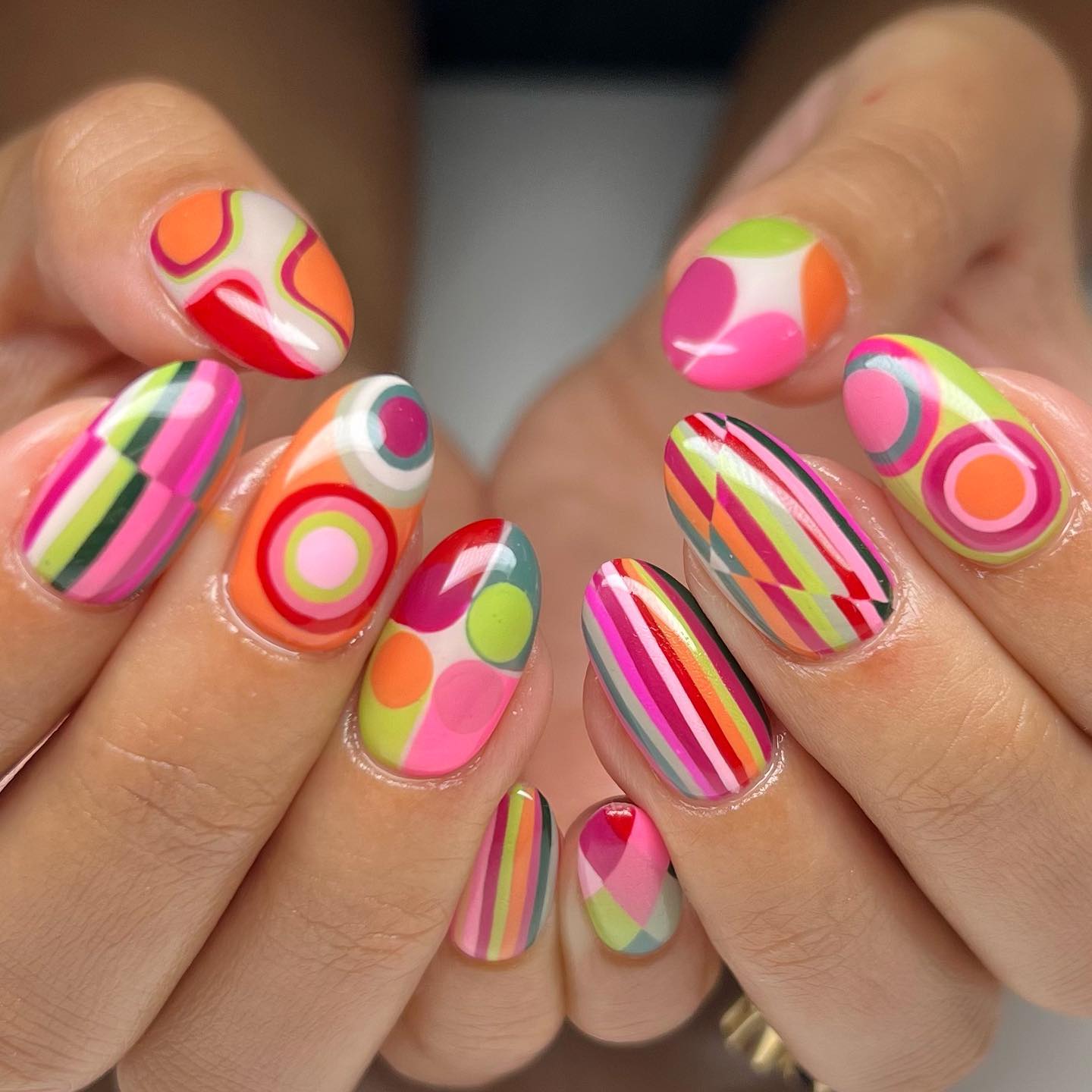 Neon retro pop art nails with bold stripes and abstract shapes