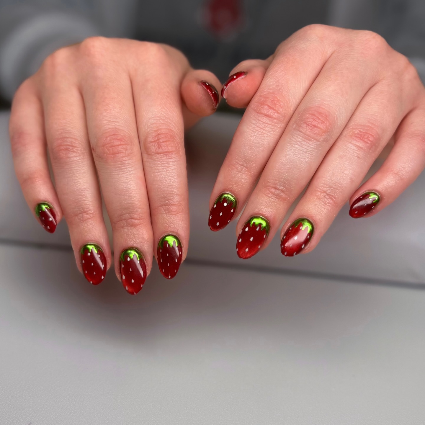 red and green strawberry nails