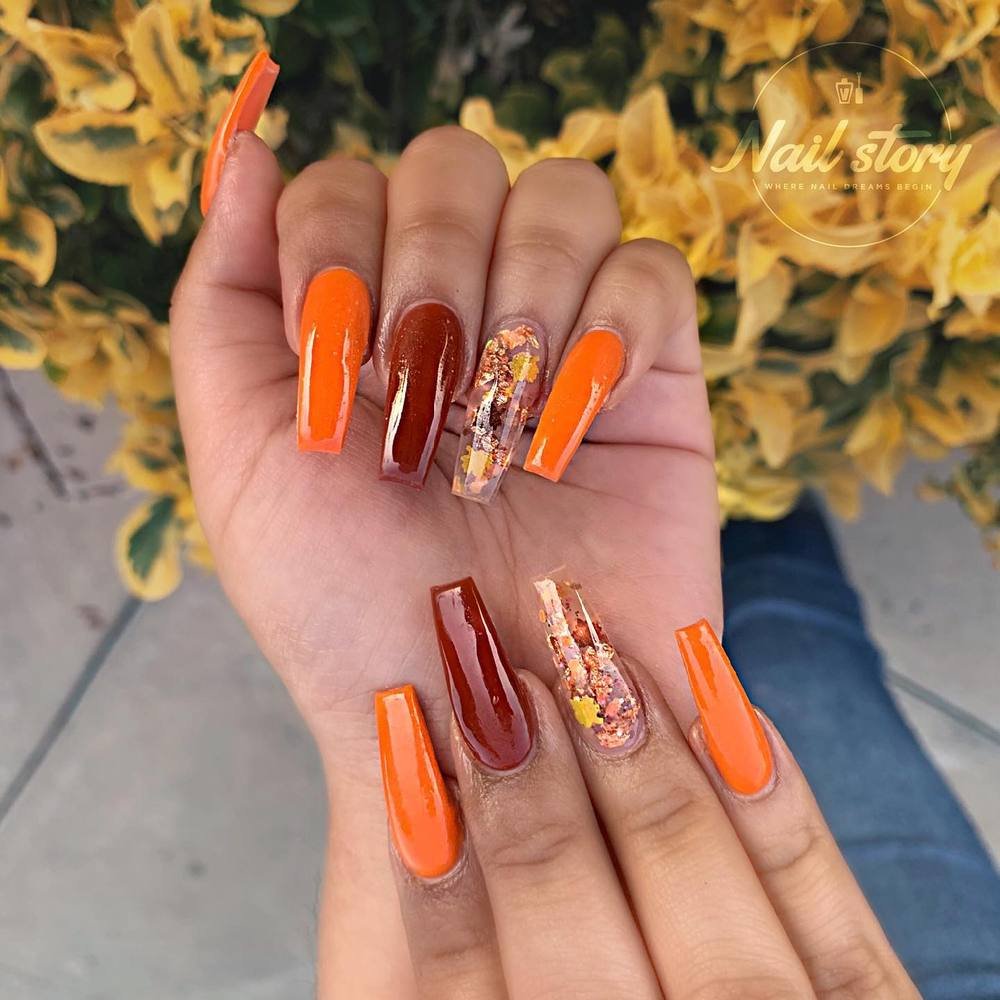 Bright Orange and Brown Nails with Autumn Floral Accents