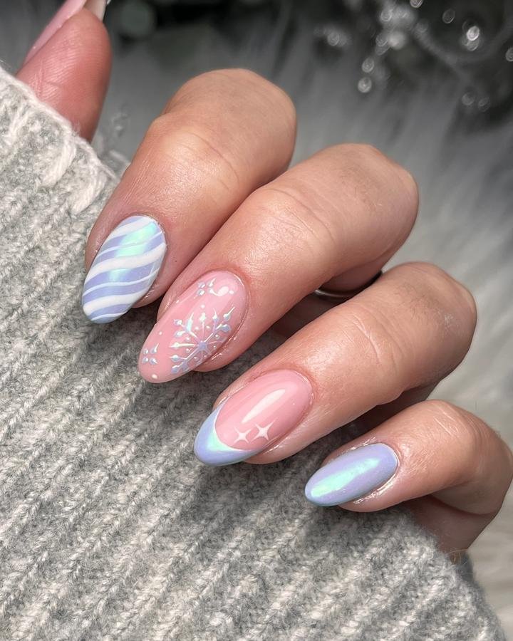 DQgZmj4DOYgCarrie Williams Nail Artist — Pastel Pink Almond Nails with Blue Tips and Snowflakes