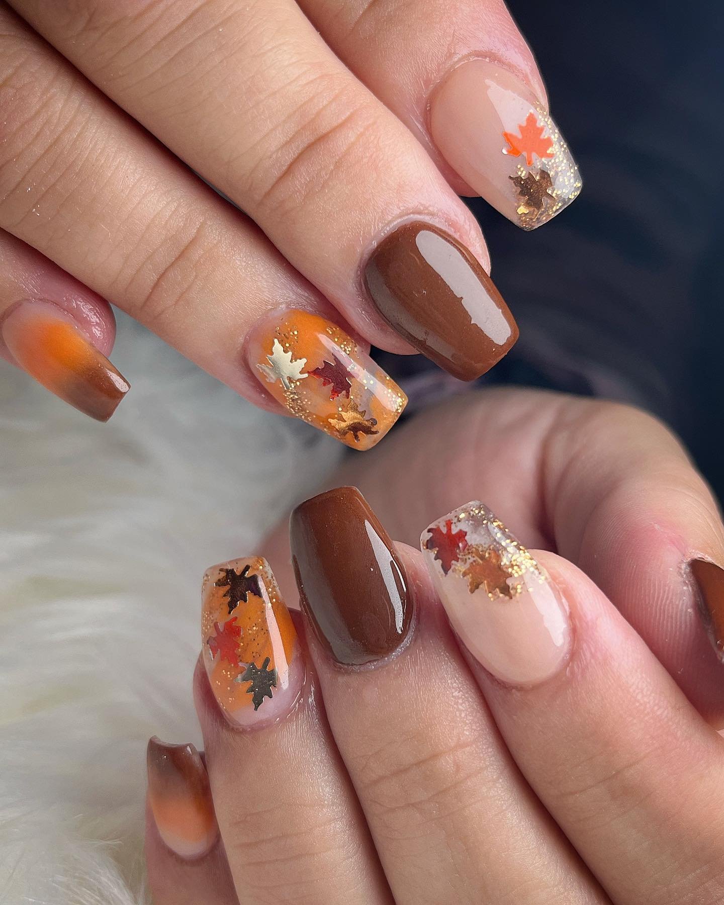 Chocolate brown and autumn leaf nails with gold sparkle
