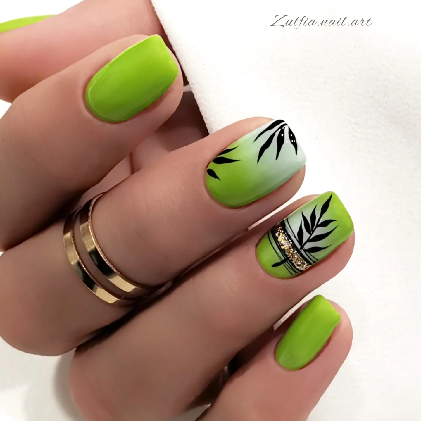 Lime green nails with black leaf line art