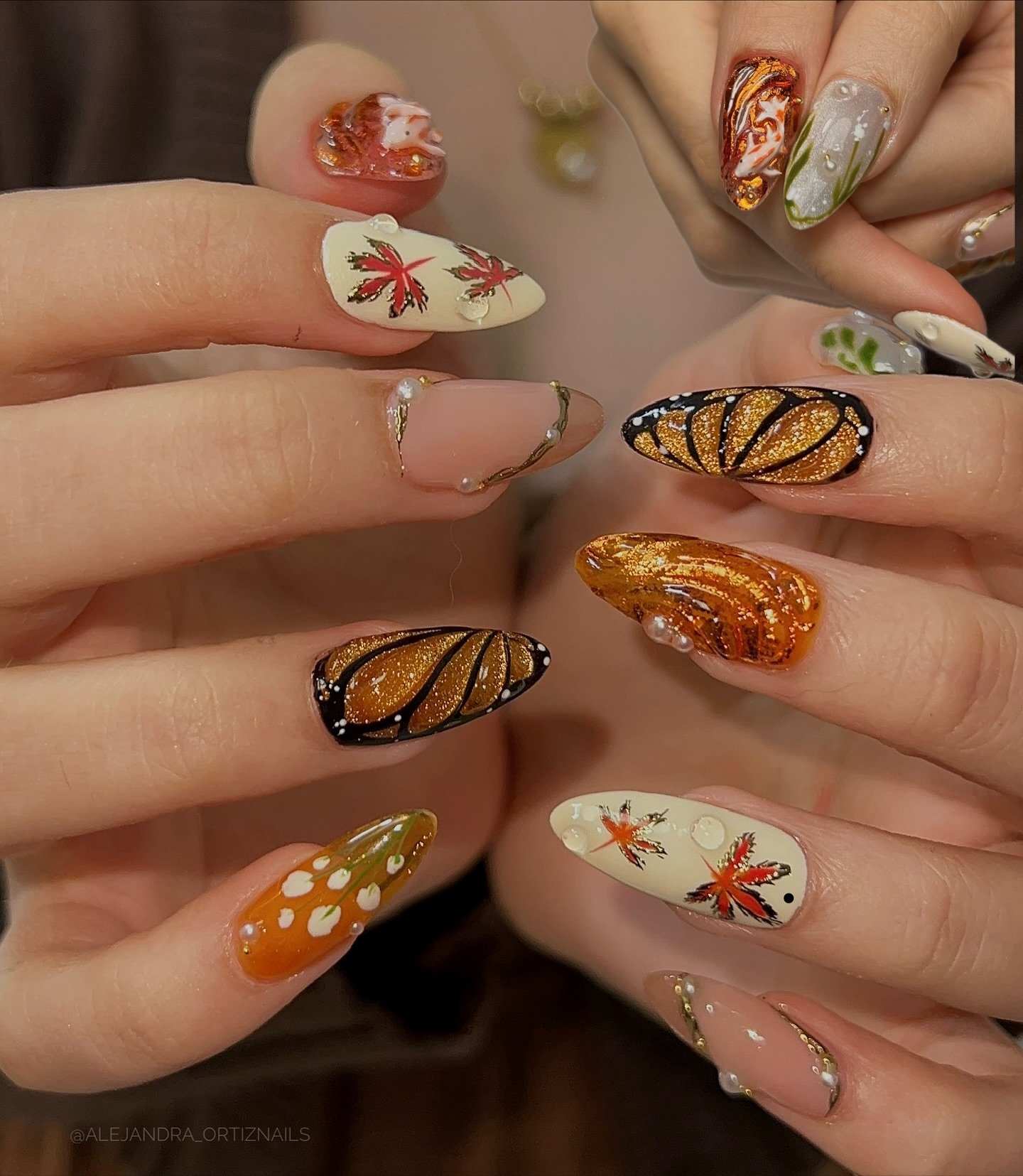 Autumn almond nails with leaves and warm orange details