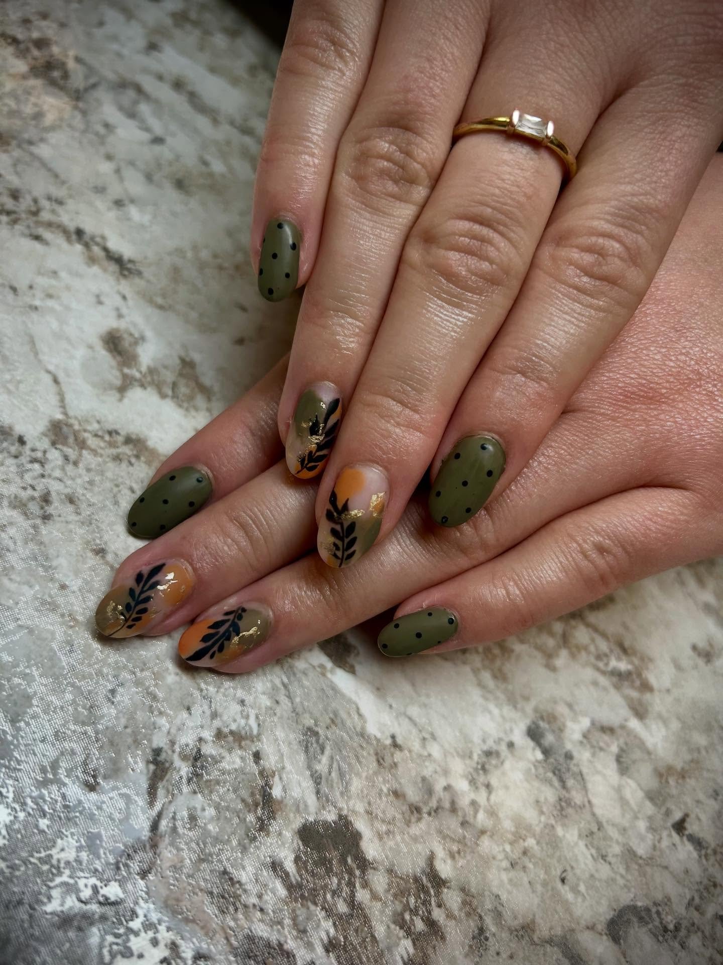 Olive green and brown almond nails with botanical details