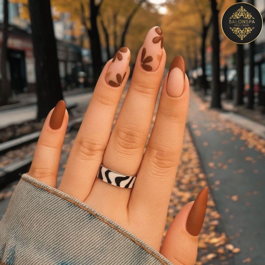 Terracotta almond nails with brown leaf motifs