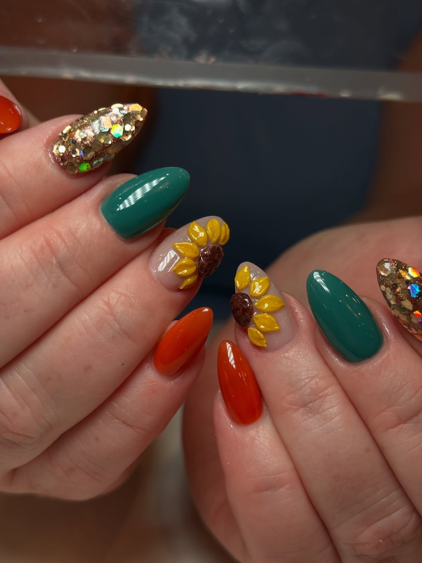 Green and Orange Nails with Sunflower Accents