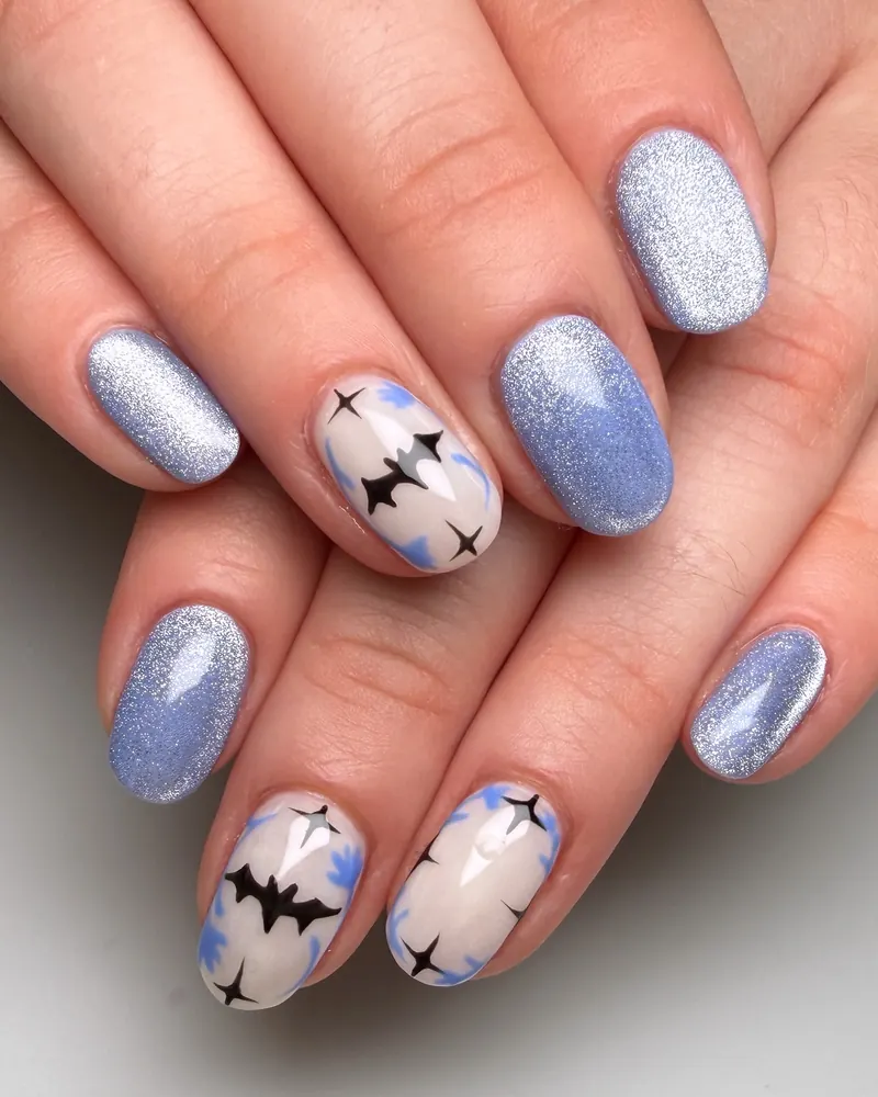 Shimmering Lavender Nails with Nude Bat Accents