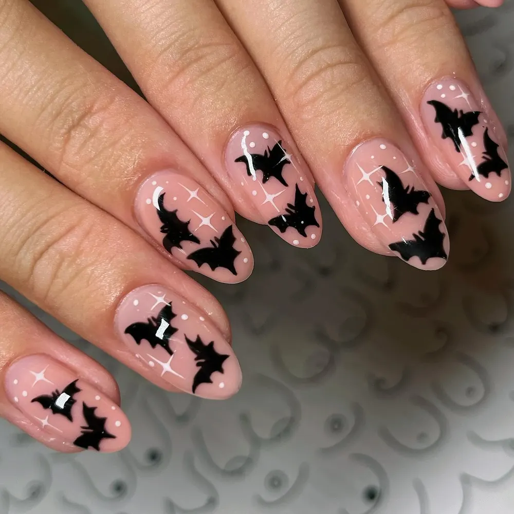 Nude Nails with Black Bats and Tiny Stars