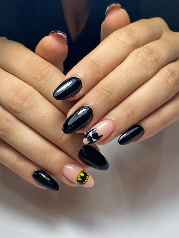 Glossy Black Nails with a Yellow Bat Accent