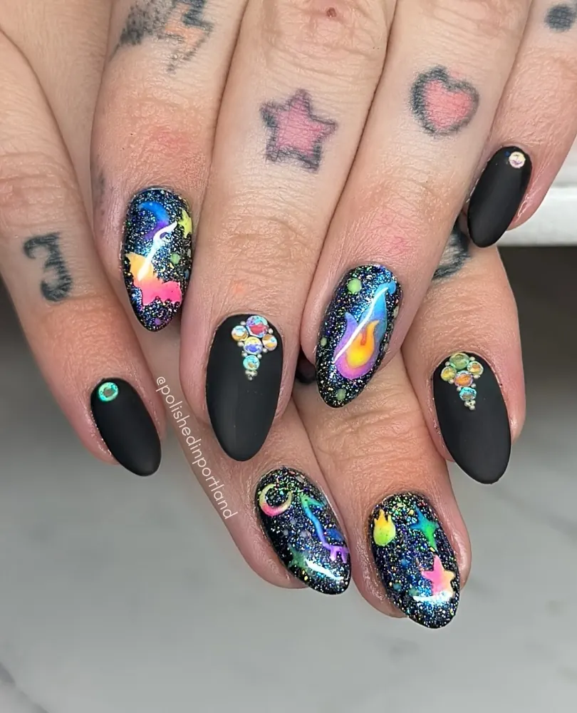 Cosmic Black Nails with Colorful Bat Accents