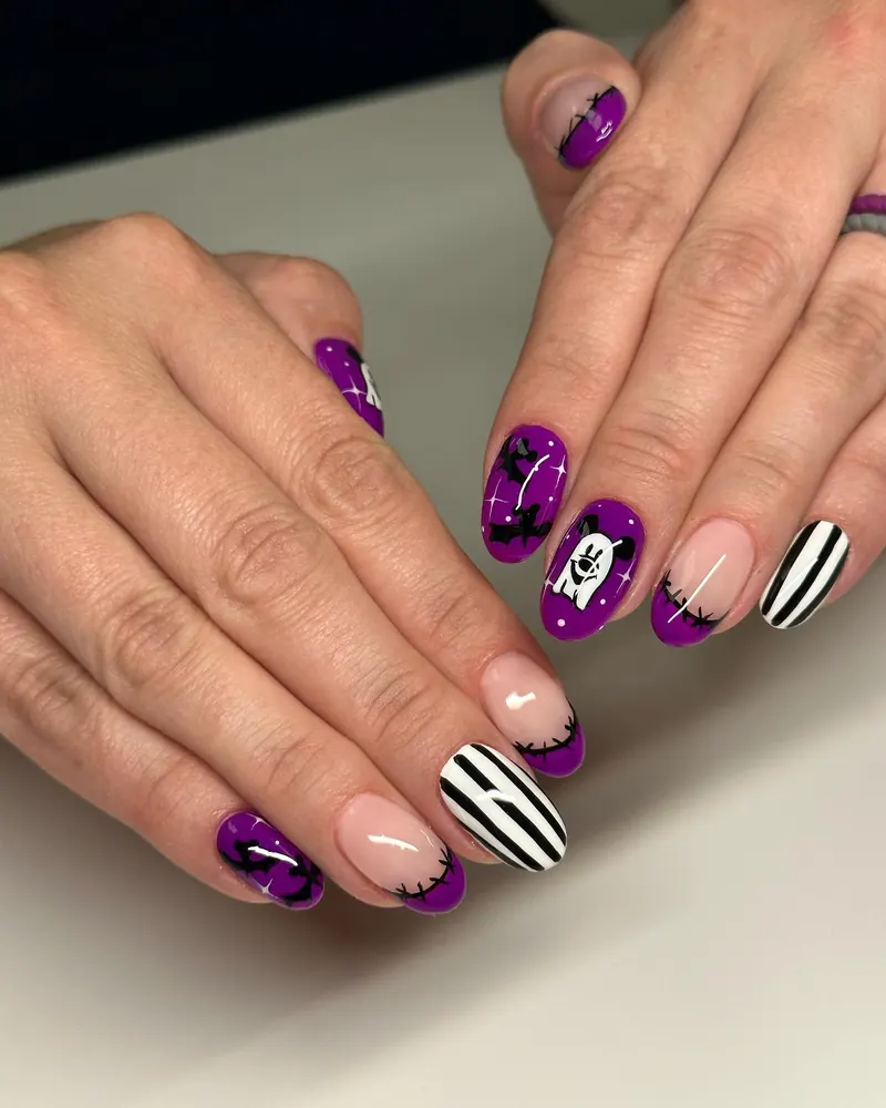 Purple and Black Halloween Nails with Bat and Stripe Accents