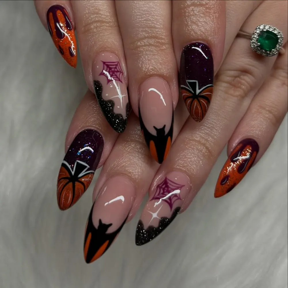 Colorful Halloween Nails with Bats, Pumpkins, and Webs