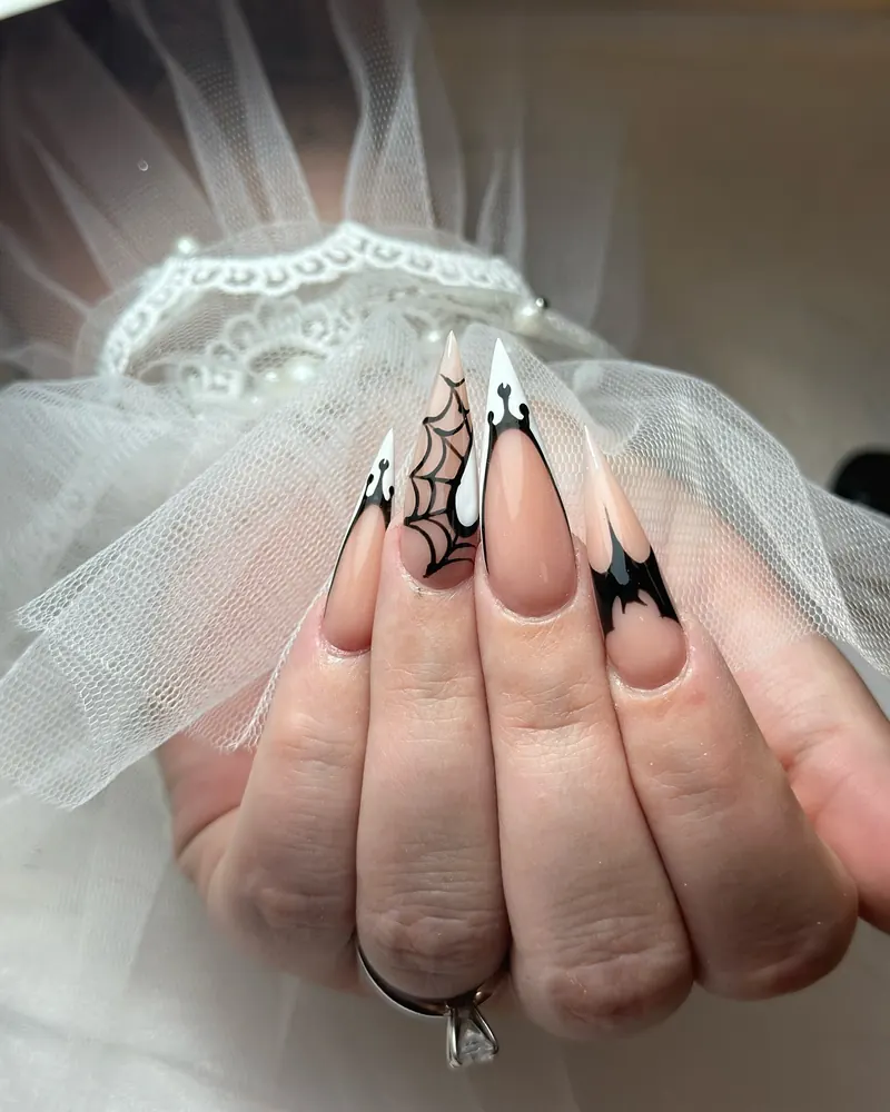 Long Nude Stiletto Nails with Black Bats and Webs