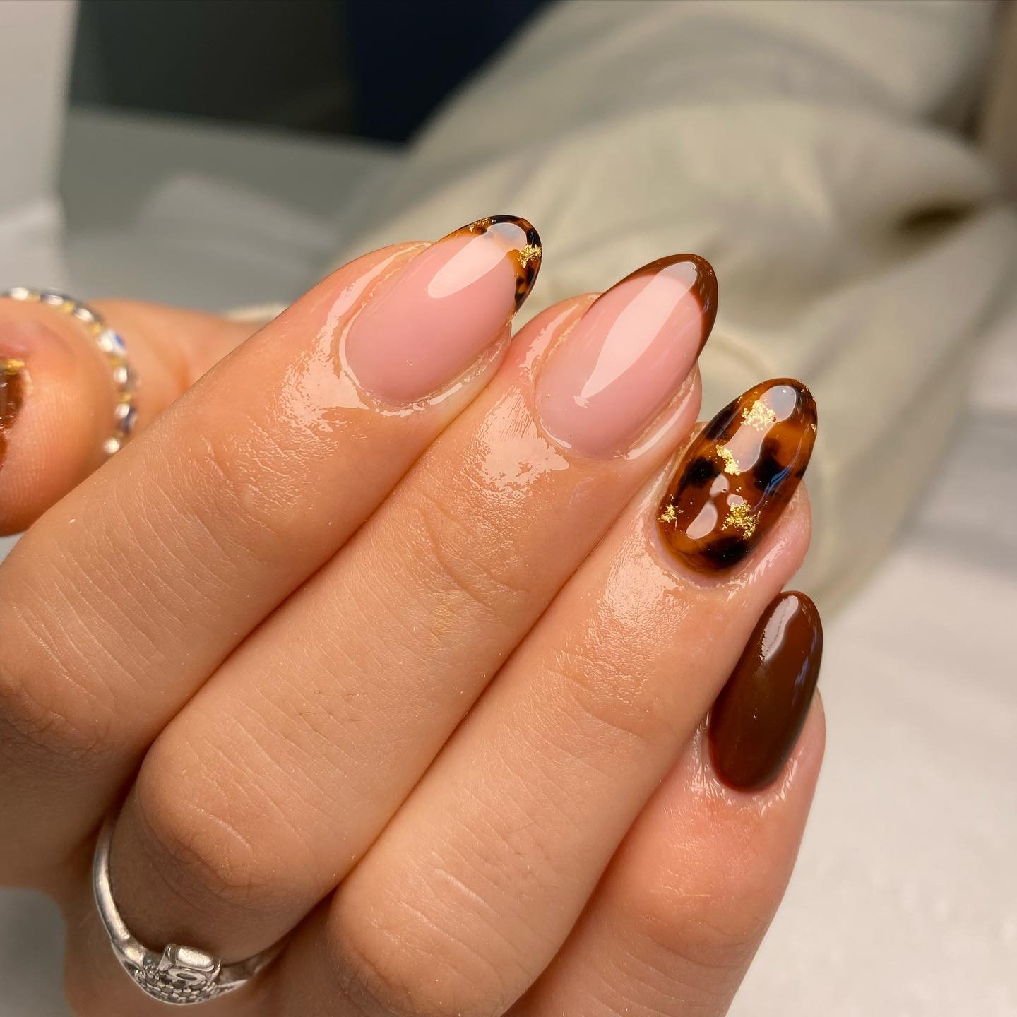 Nude Almond Nails with Brown French Tips