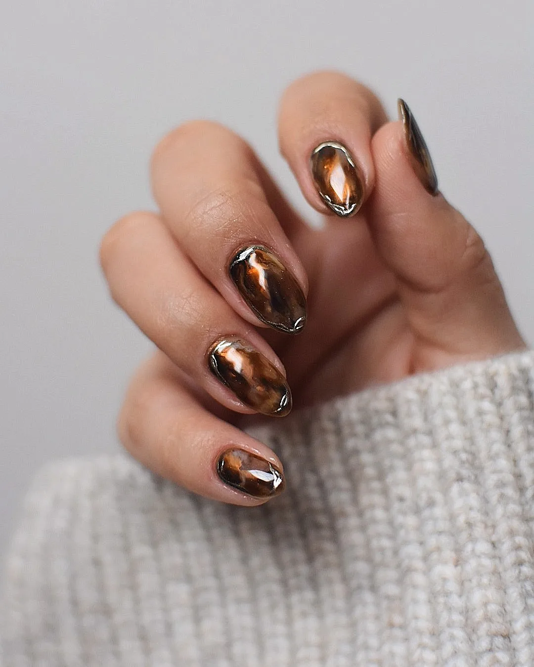 Reflective Bronze-Brown Almond Nails