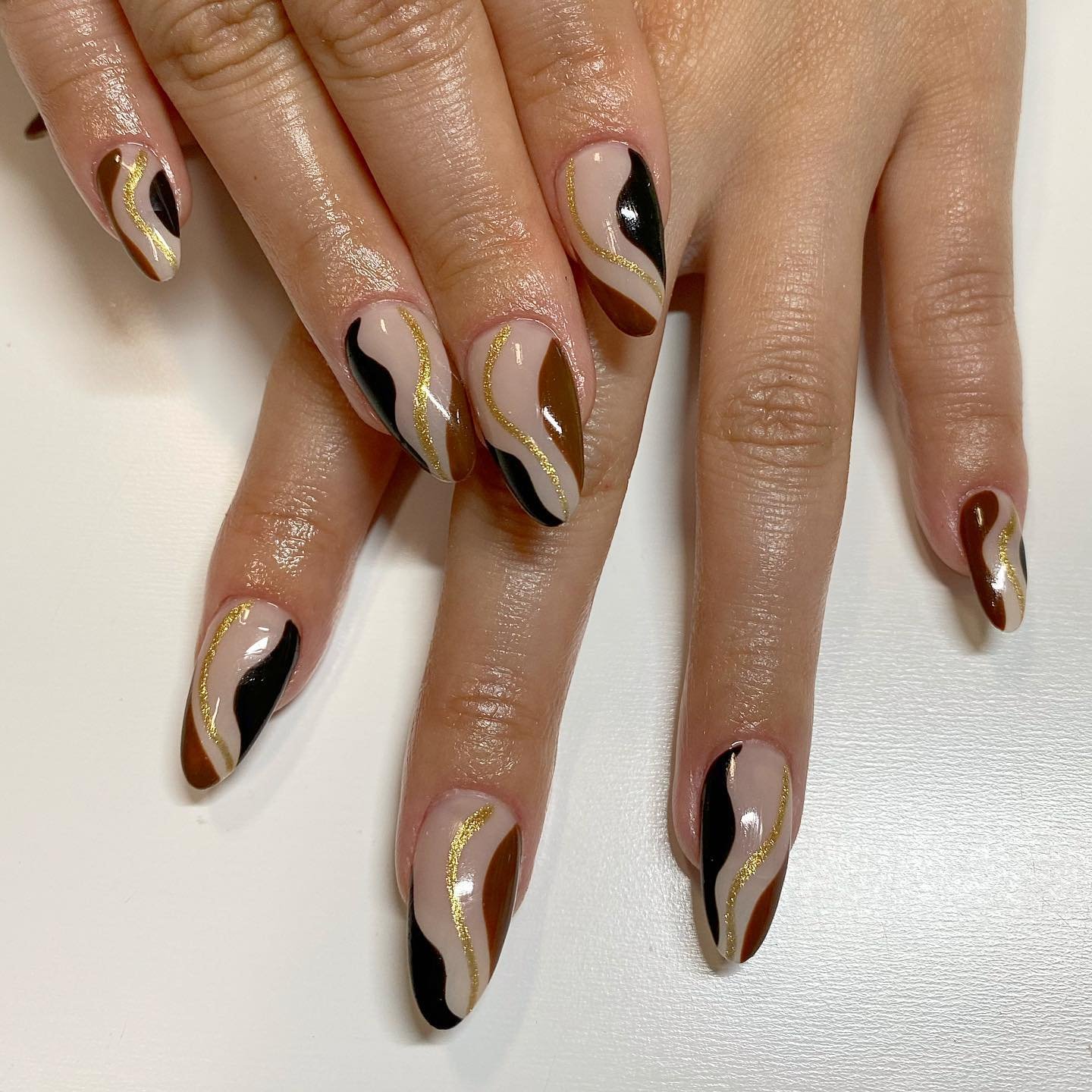 Nude Almond Nails with Flowing Brown Tips