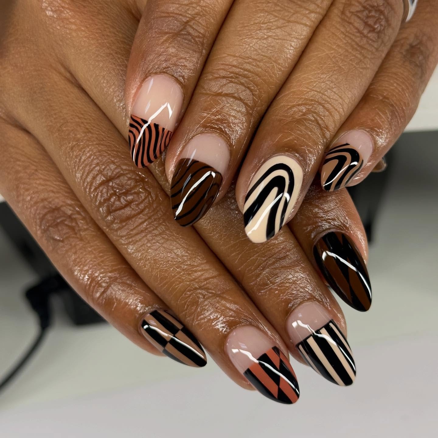 Brown Nails with Black-and-White Curved Art
