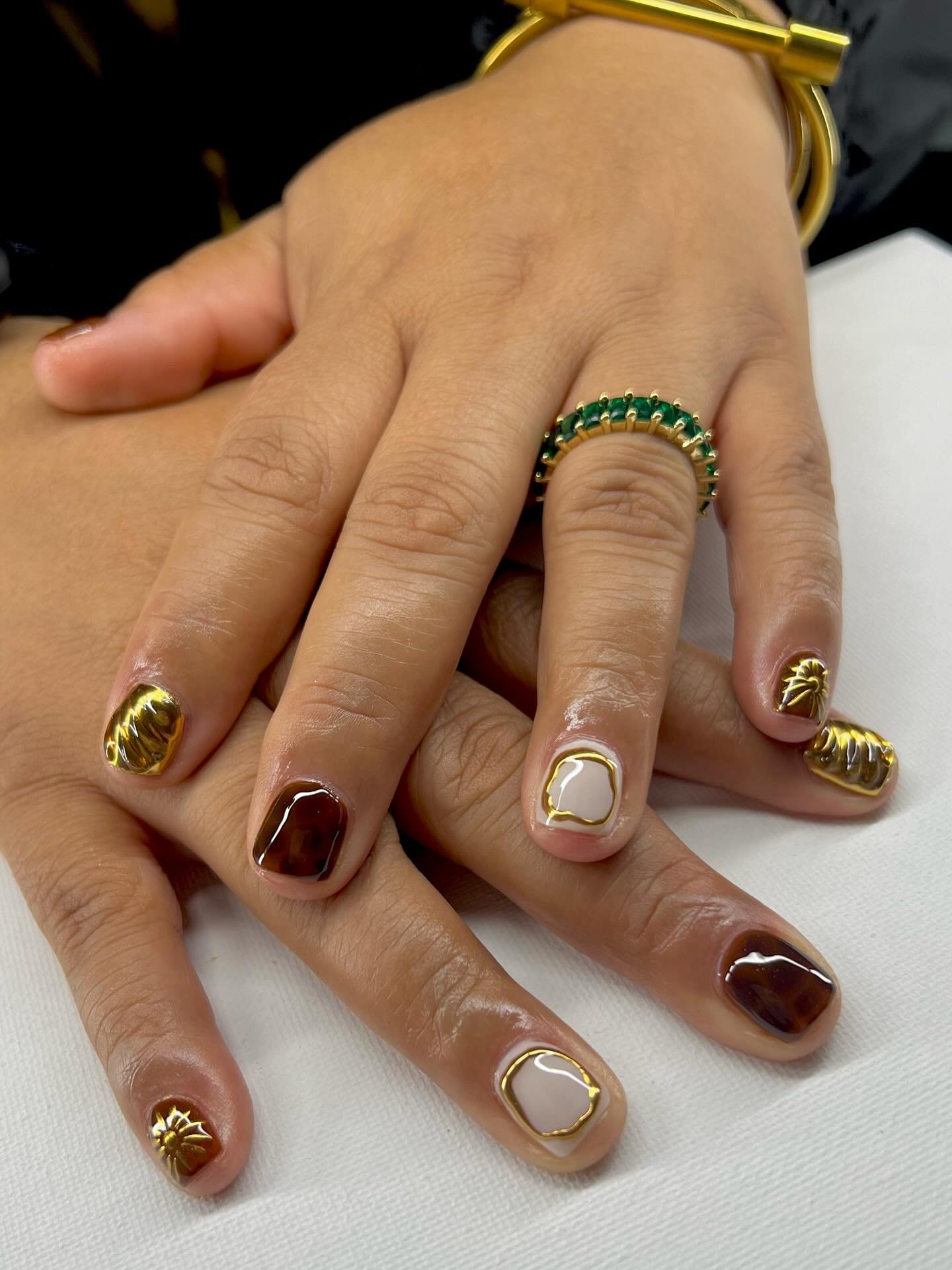 Nude, Brown, and Black Nails with Gold Accents