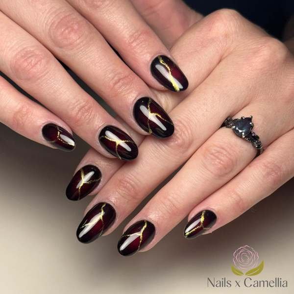 Black Cherry Nails with Gold Curved Accents
