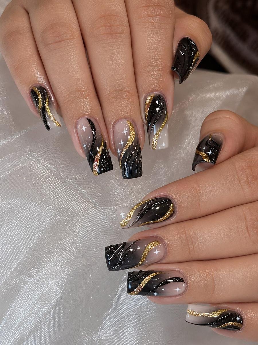 Black and Gold Almond Nails with Sparkling Details
