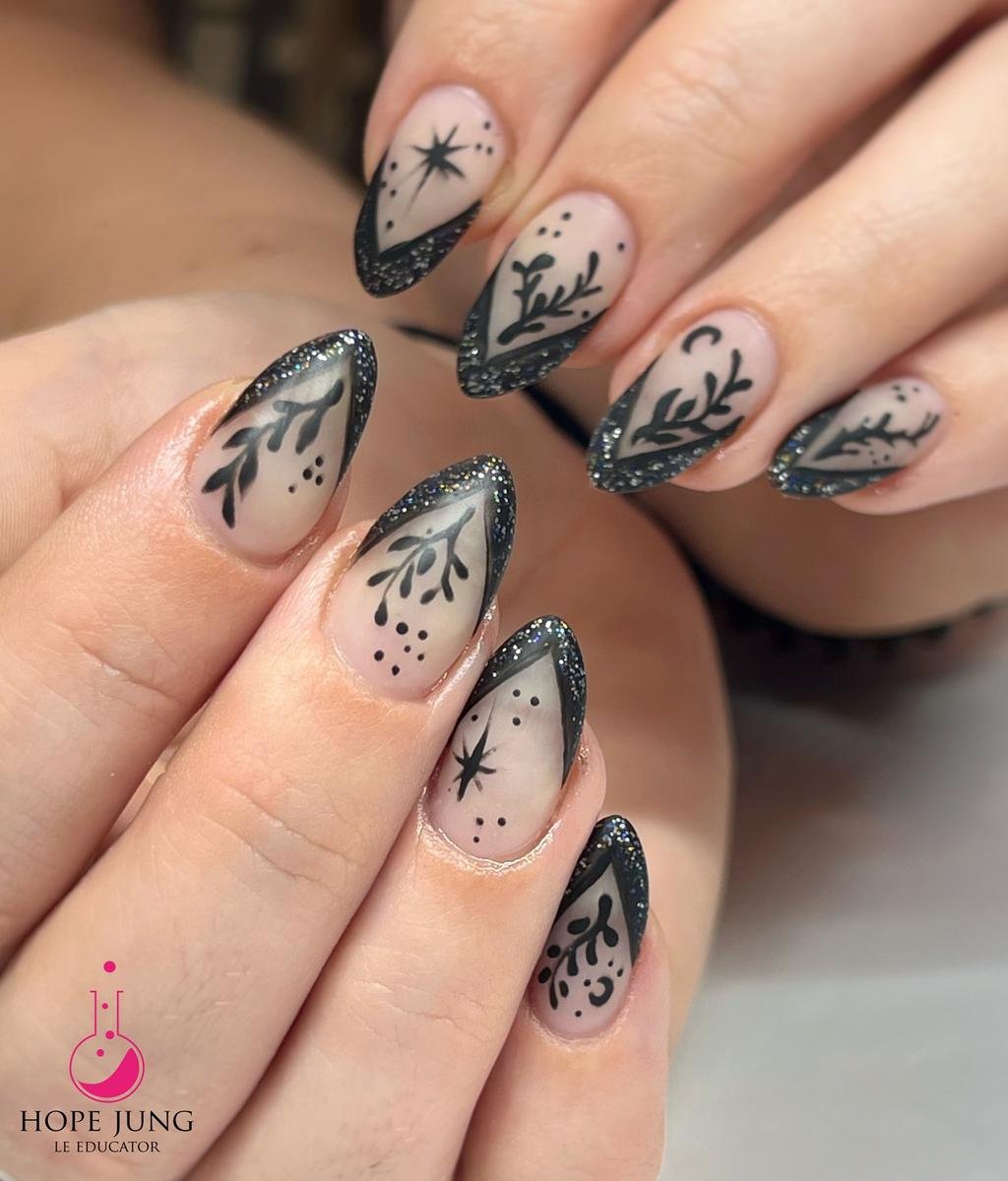 Sheer Nude Almond Nails with Black Botanical Details