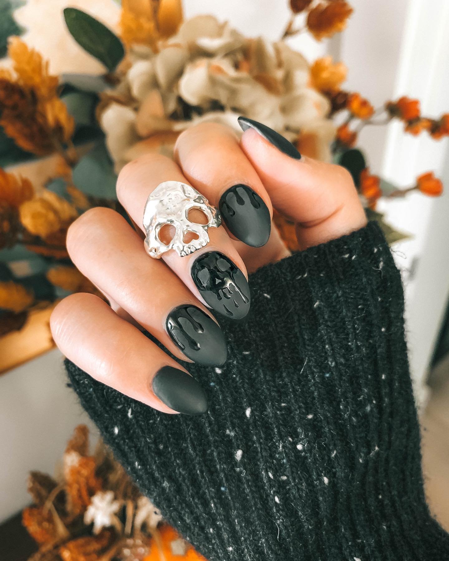 Black and White Halloween Nails with a Skull Accent