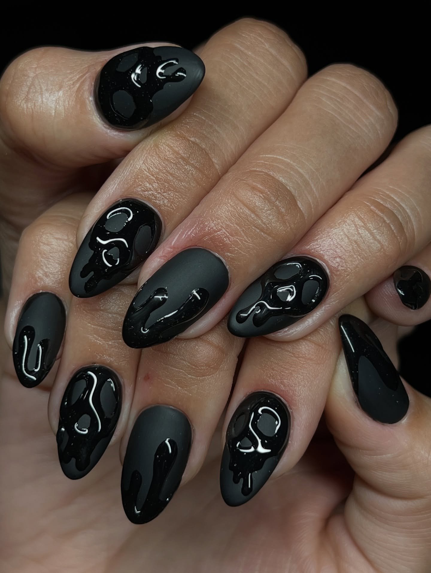Glossy Black Nails with Small White Motifs