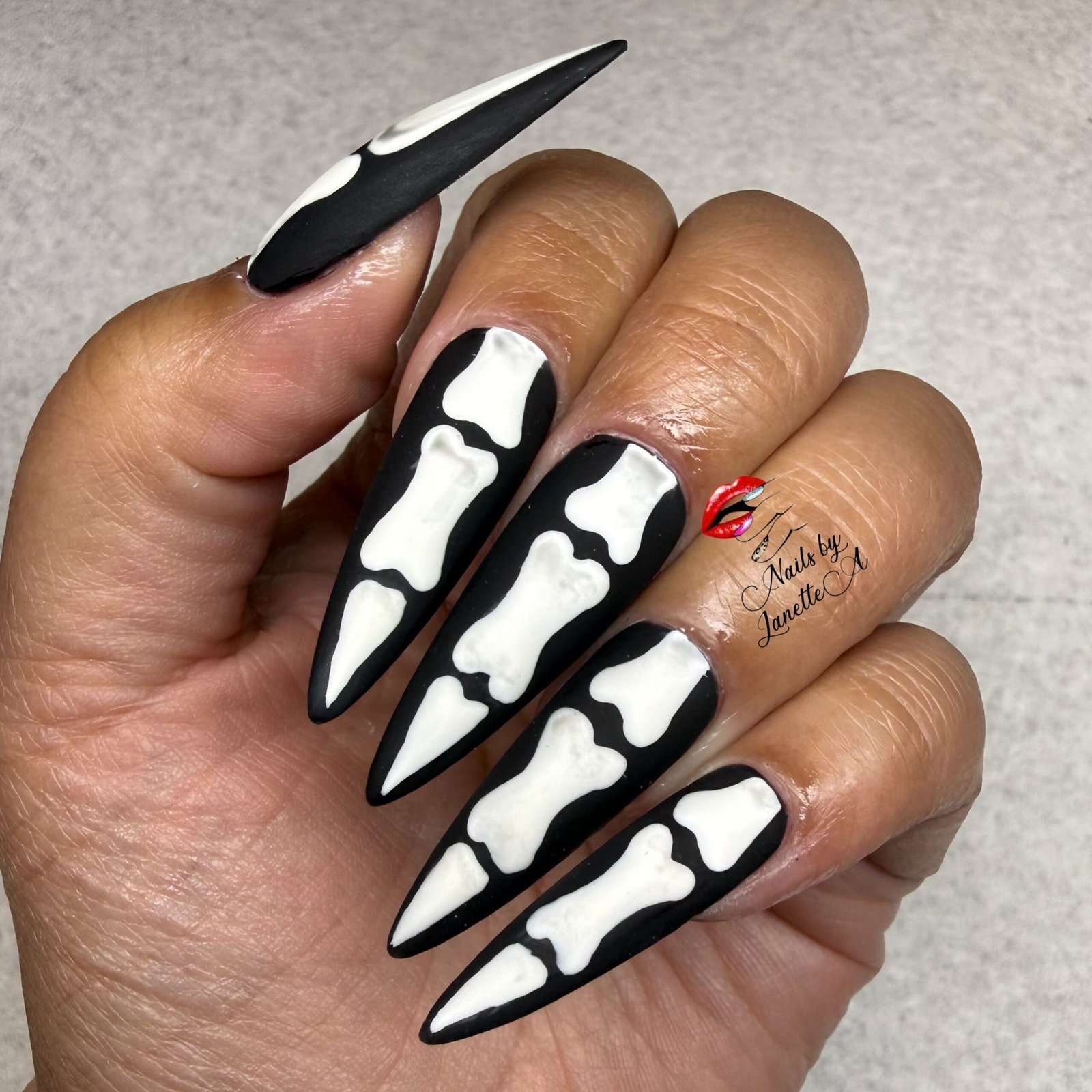 Black and White Drip-Style Stiletto Nails
