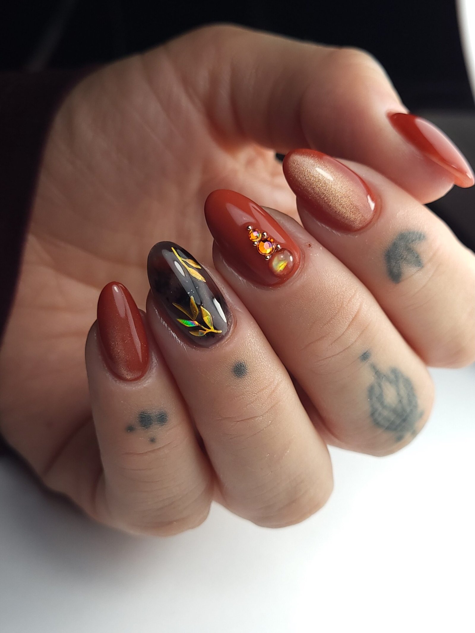 Berry, Brown, and Metallic Mixed Nail Design