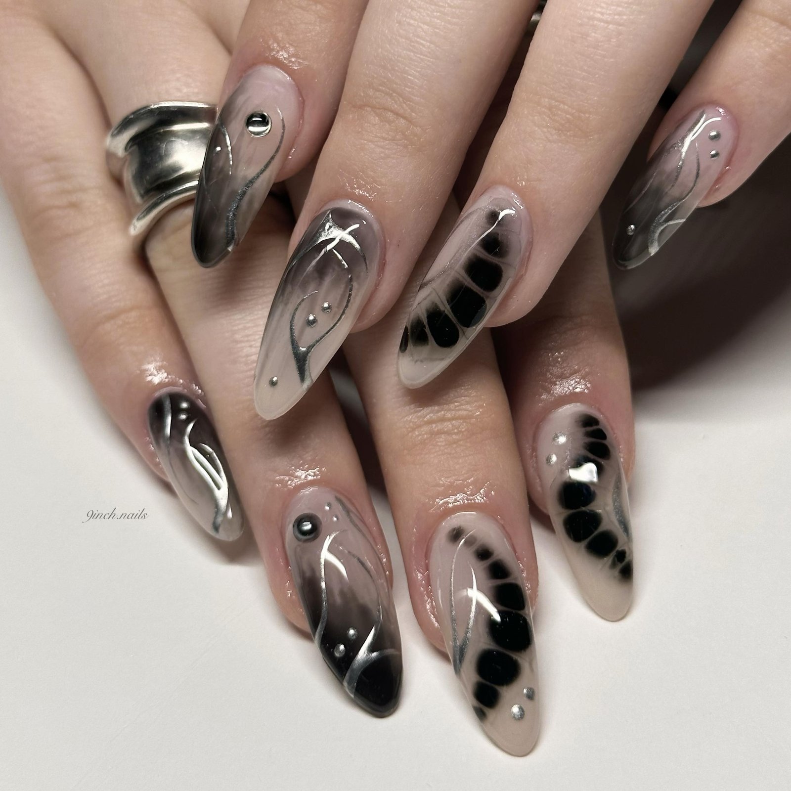 Black and Nude Abstract Almond Nails