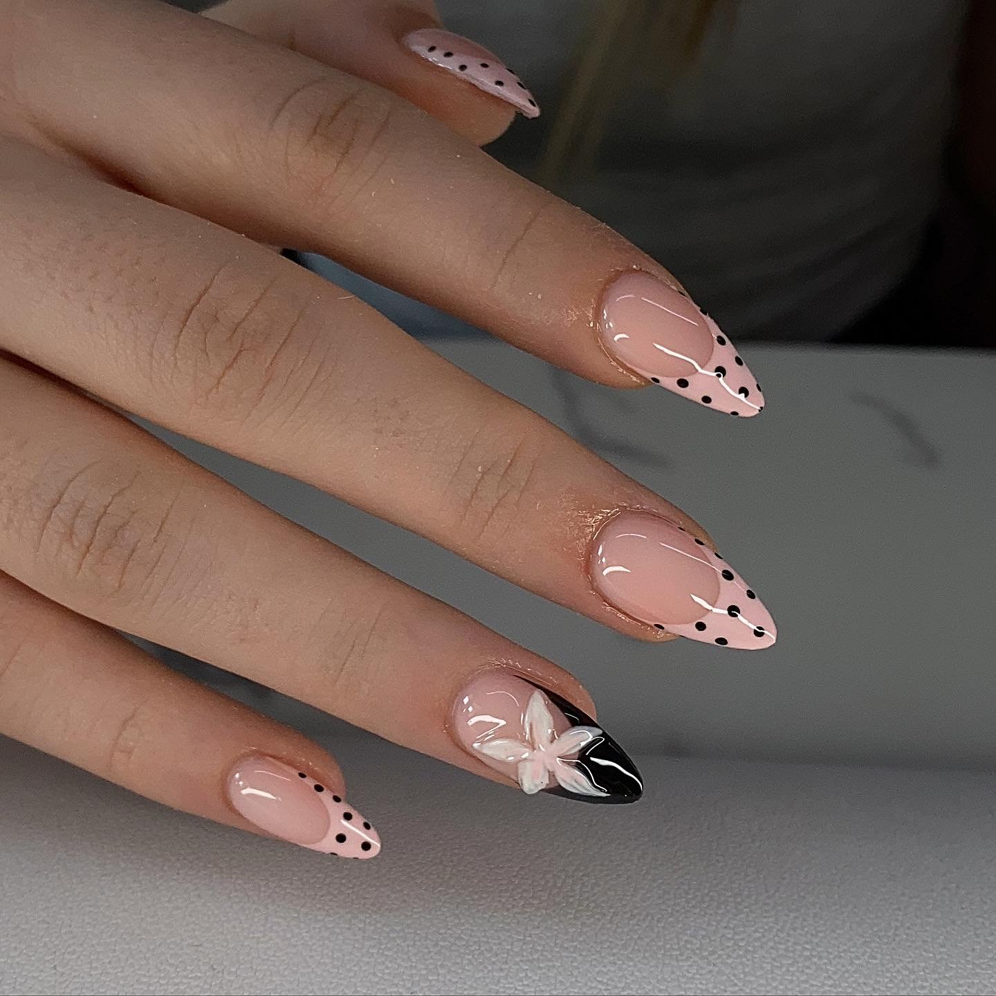 Nude Stiletto Nails with Dark Speckled Accents