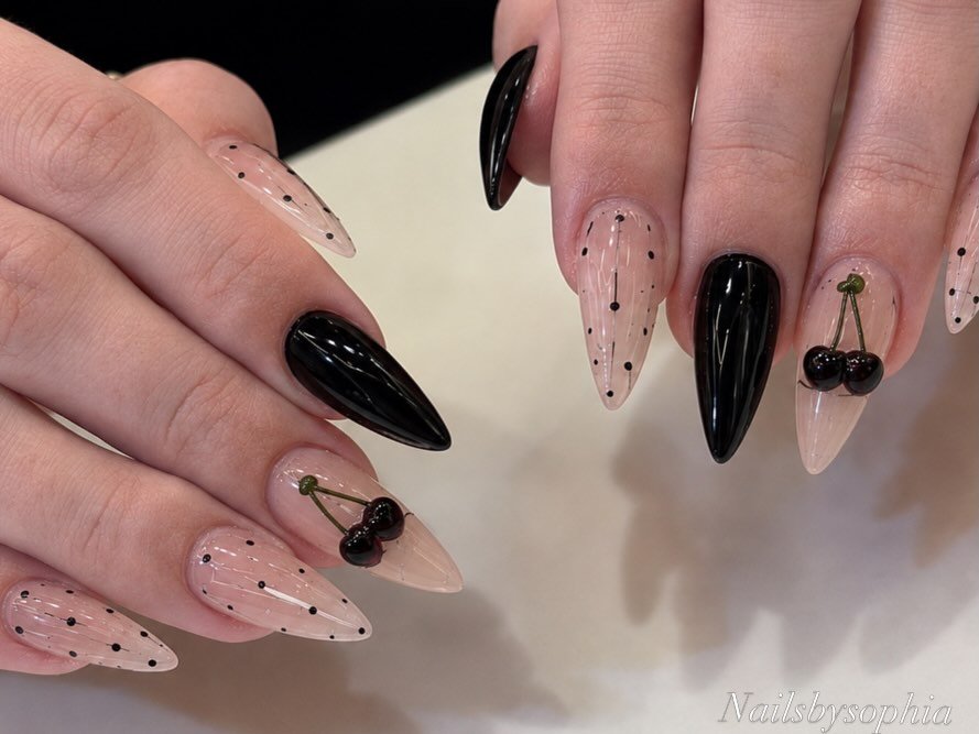 Black and Nude Almond Nails with Minimal Dark Accents