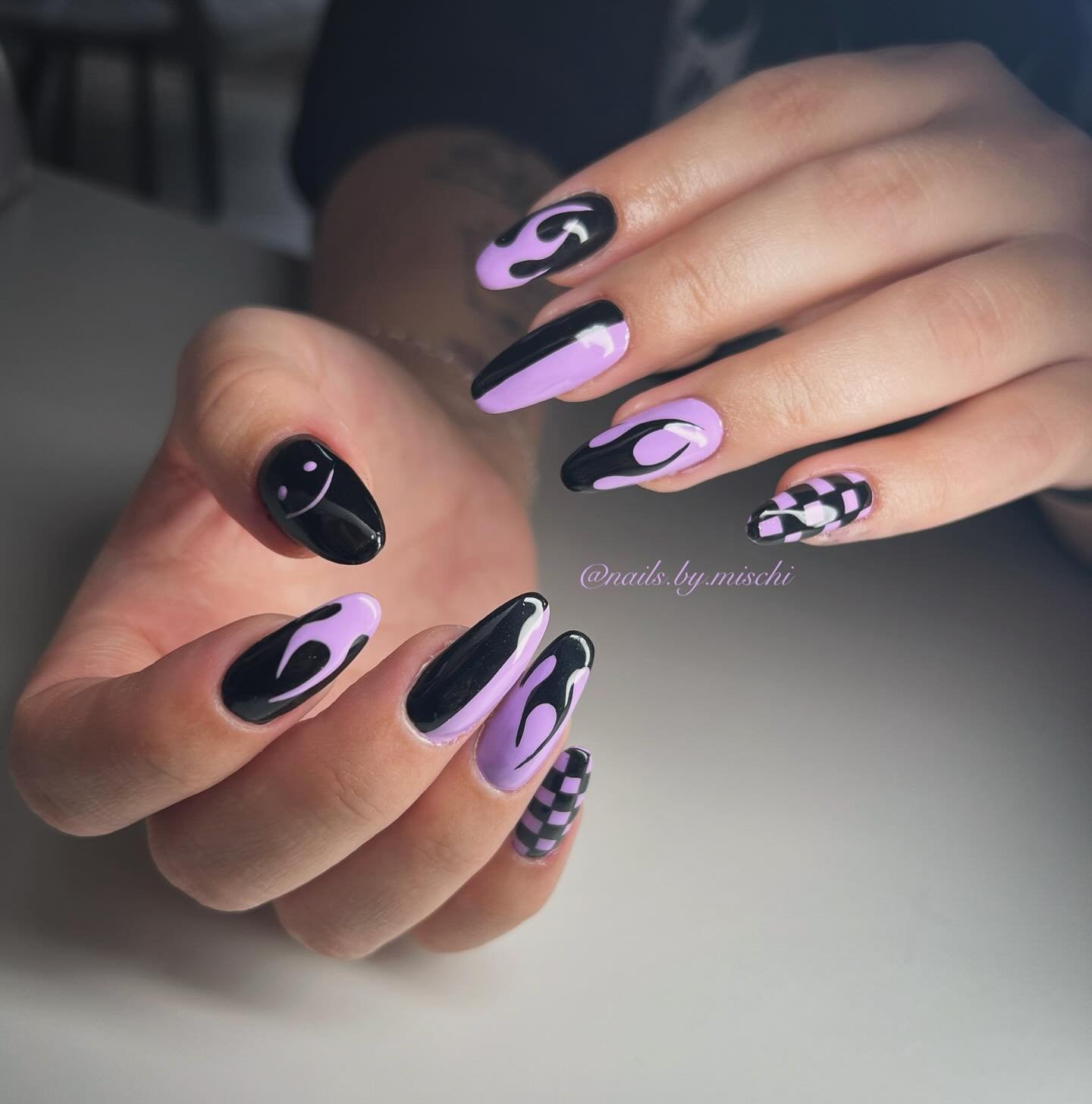 Lavender Almond Nails with Black Abstract and Animal-Print Accents