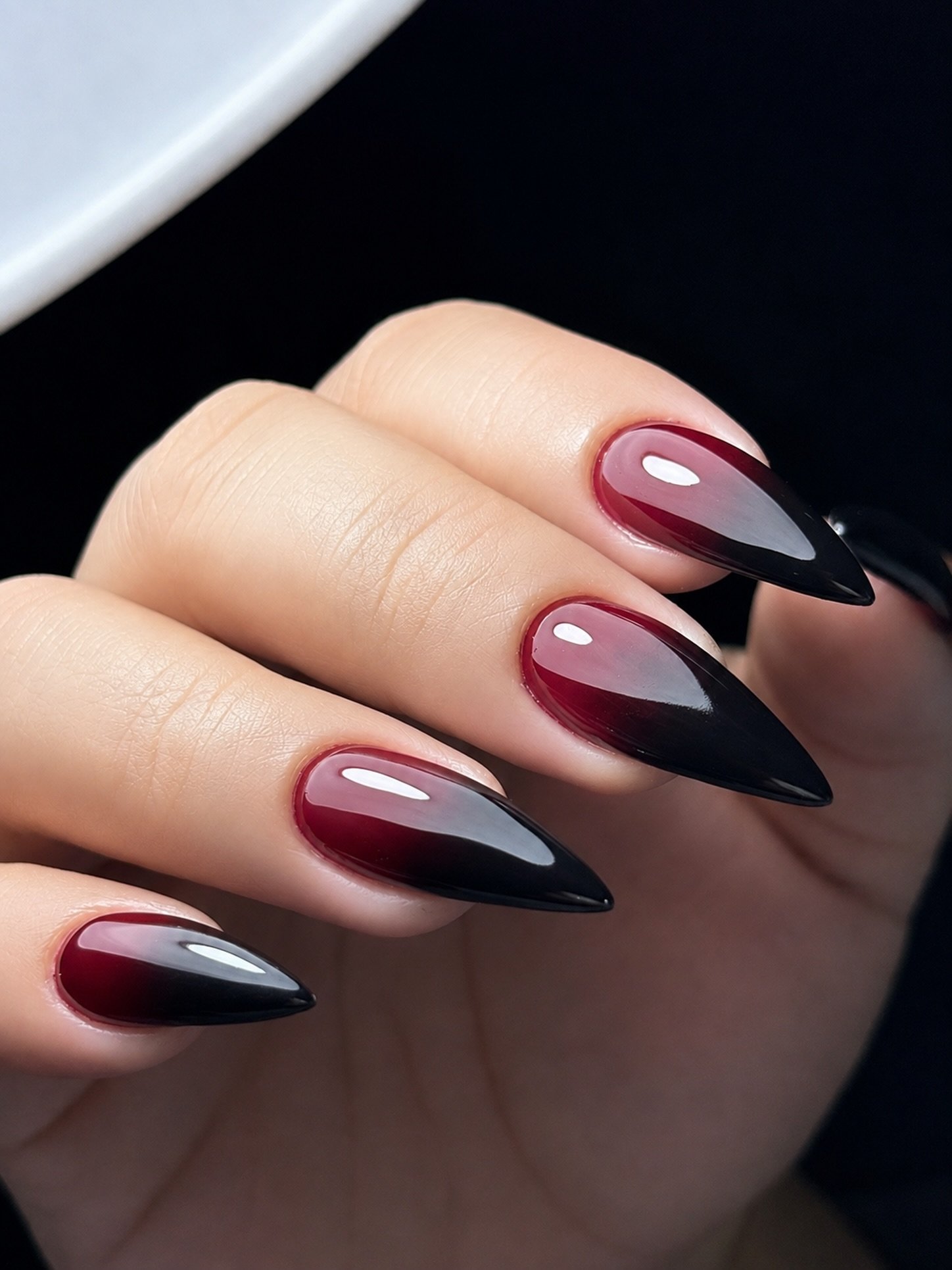 Burgundy Almond Nails with Black and Nude Contrast