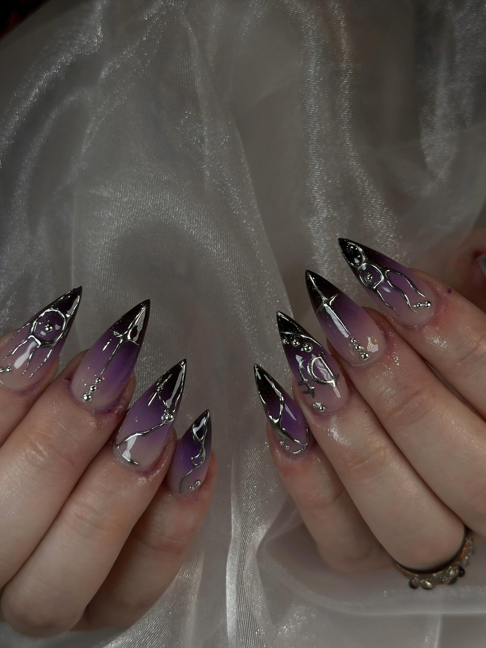 Long Smoky Purple Stiletto Nails with Glitter Accents