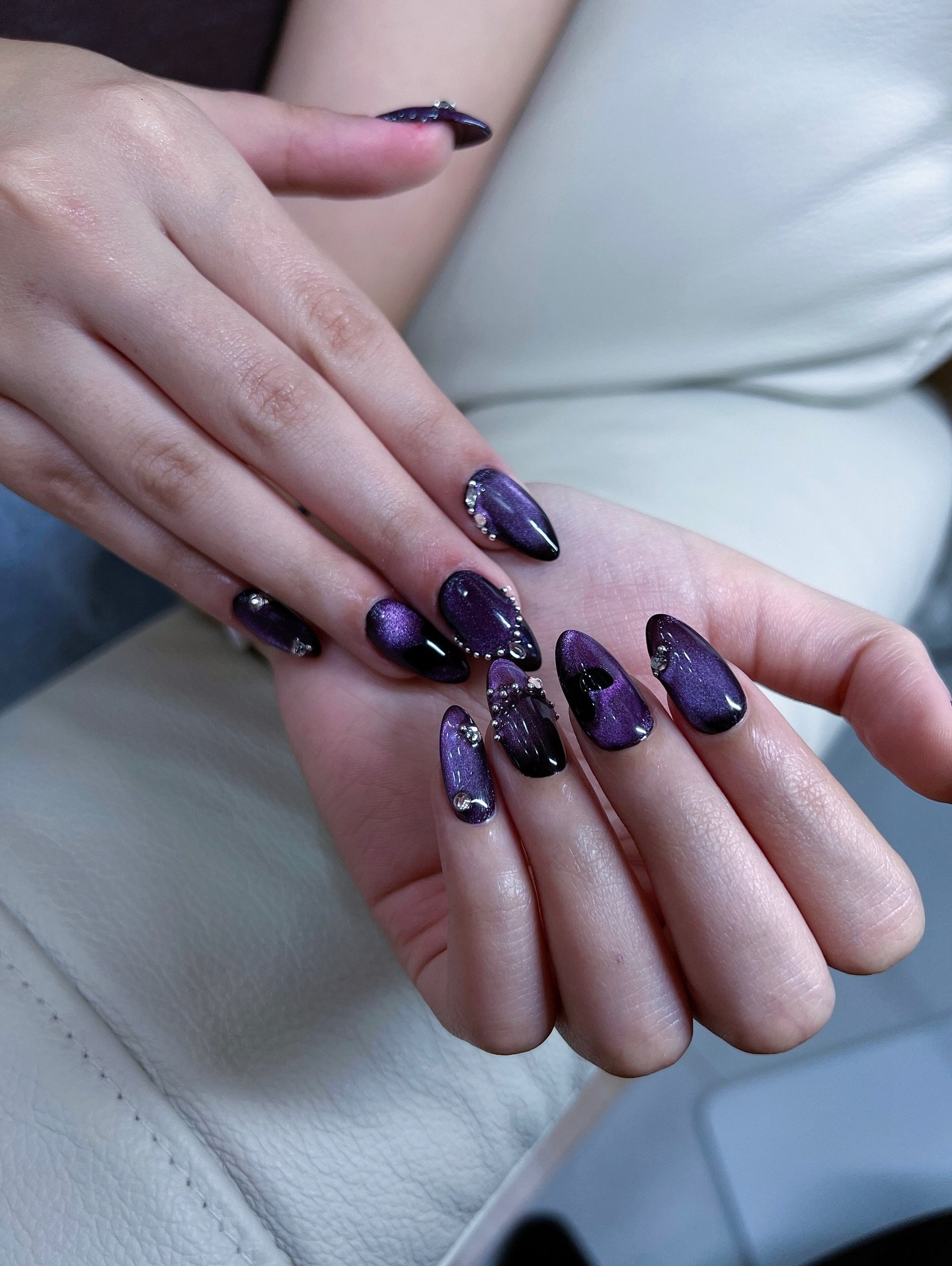 Deep Purple Almond Nails with Sparkling Accents