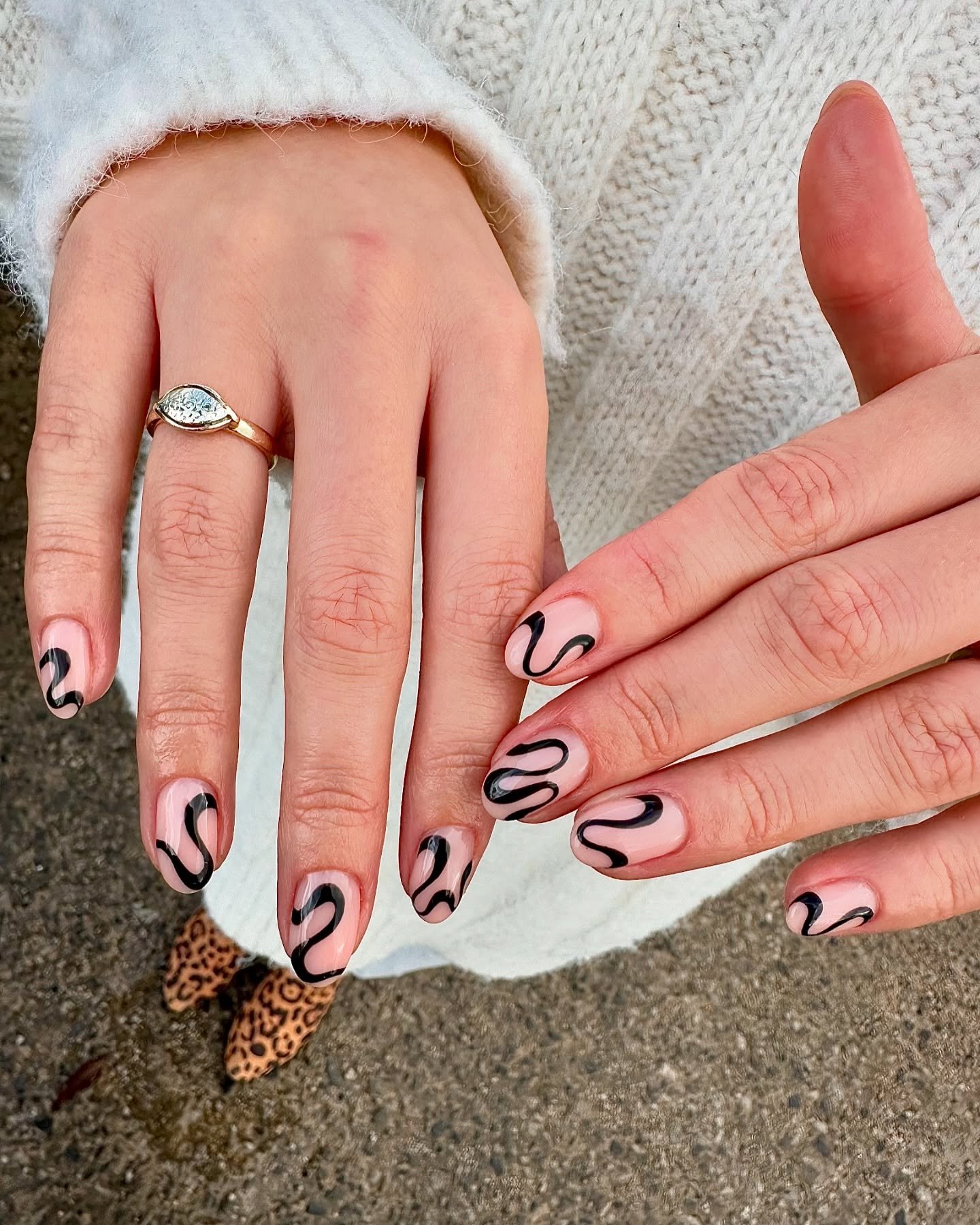 Pink and White Almond Nails with Black Line Art
