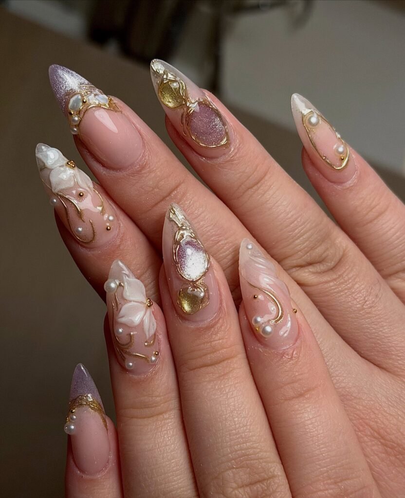 Long Nude Stiletto Nails with Crystal and Gold Accents