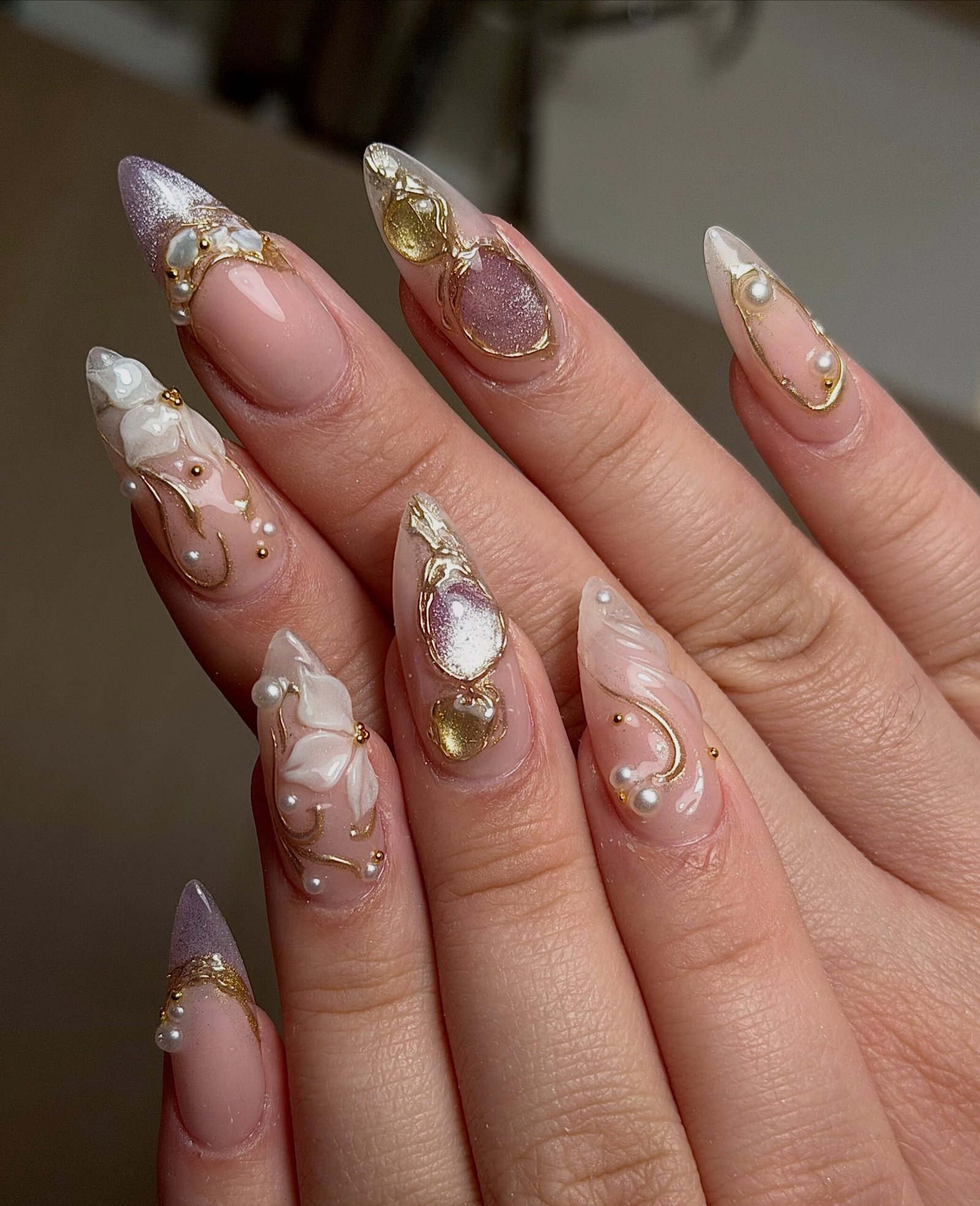 Long Nude Stiletto Nails with Crystal and Gold Accents